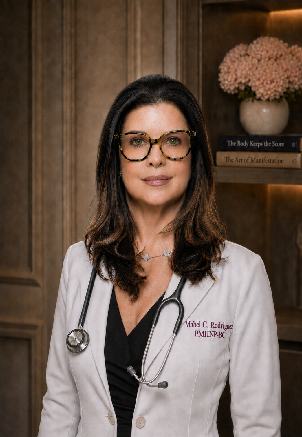 Mabel C. Rodriguez, PMHNP-BC, in a white coat with a stethoscope